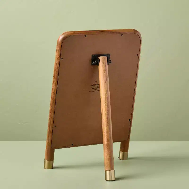 Specchio accentato in legno con piedini in ottone