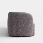 Divanetto curvo in tessuto bouclé Boho con cuscini a molle insacchettate