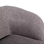 Divanetto curvo in tessuto bouclé Boho con cuscini a molle insacchettate