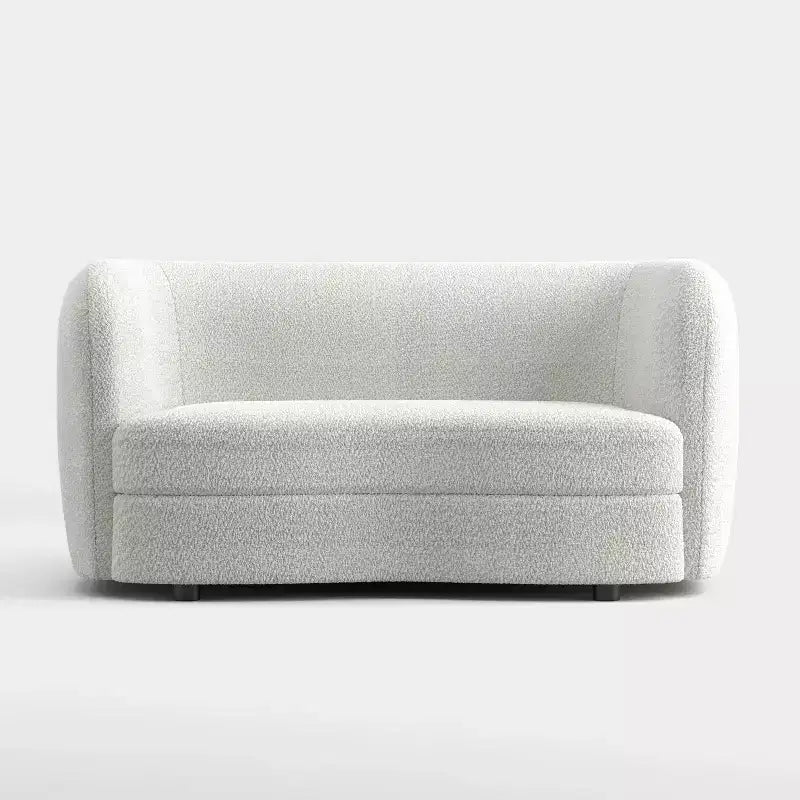 Divanetto curvo in tessuto bouclé Boho con cuscini a molle insacchettate