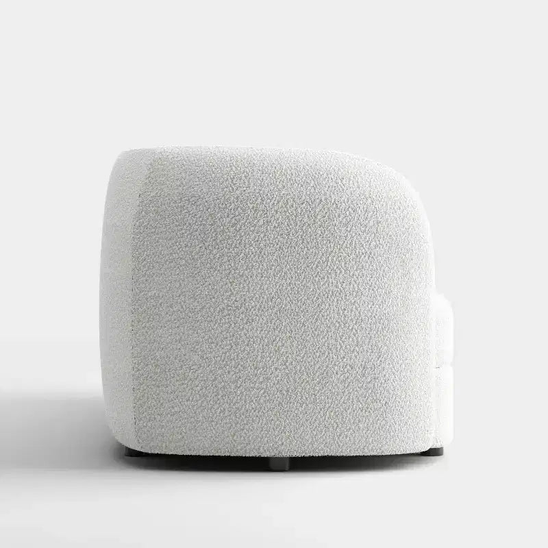 Divanetto curvo in tessuto bouclé Boho con cuscini a molle insacchettate
