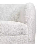 Divanetto curvo in tessuto bouclé Boho con cuscini a molle insacchettate