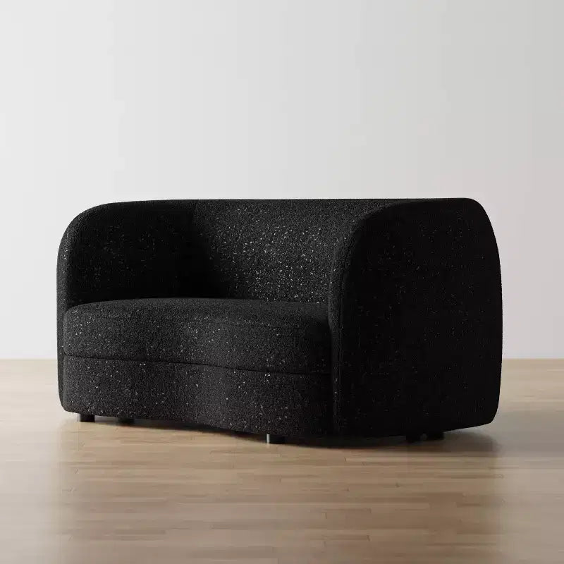 Divanetto curvo in tessuto bouclé Boho con cuscini a molle insacchettate