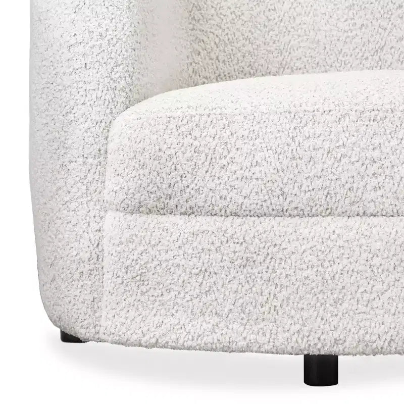 Divanetto curvo in tessuto bouclé Boho con cuscini a molle insacchettate