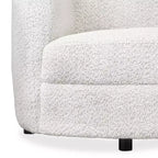 Divanetto curvo in tessuto bouclé Boho con cuscini a molle insacchettate
