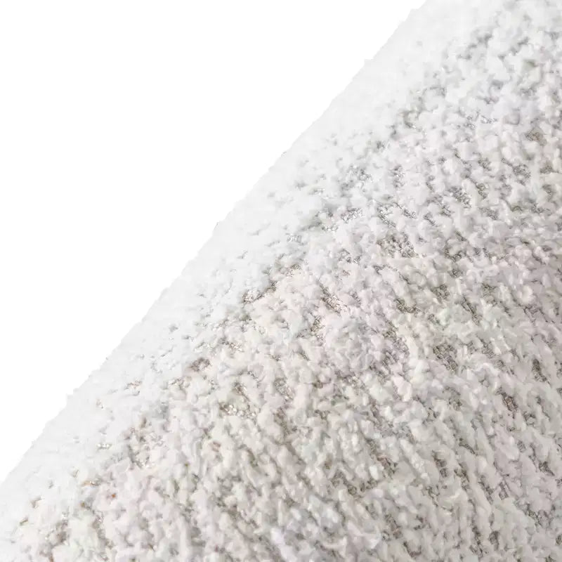 Divanetto curvo in tessuto bouclé Boho con cuscini a molle insacchettate