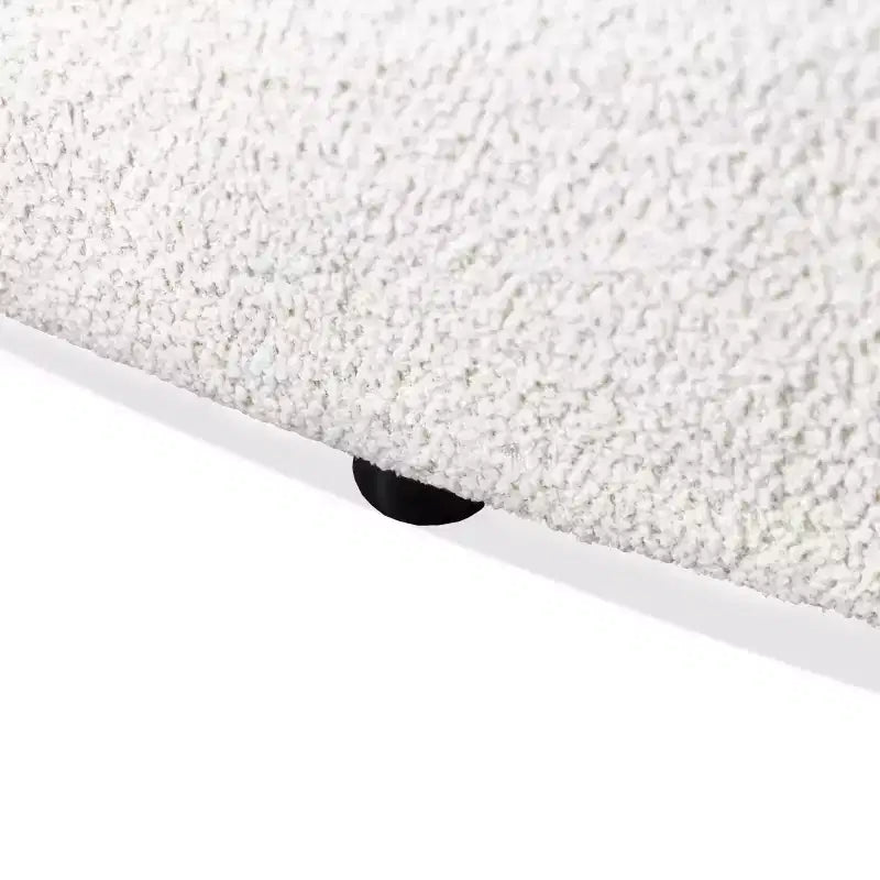 Divanetto curvo in tessuto bouclé Boho con cuscini a molle insacchettate