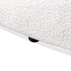 Divanetto curvo in tessuto bouclé Boho con cuscini a molle insacchettate
