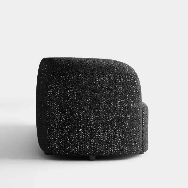 Divanetto curvo in tessuto bouclé Boho con cuscini a molle insacchettate