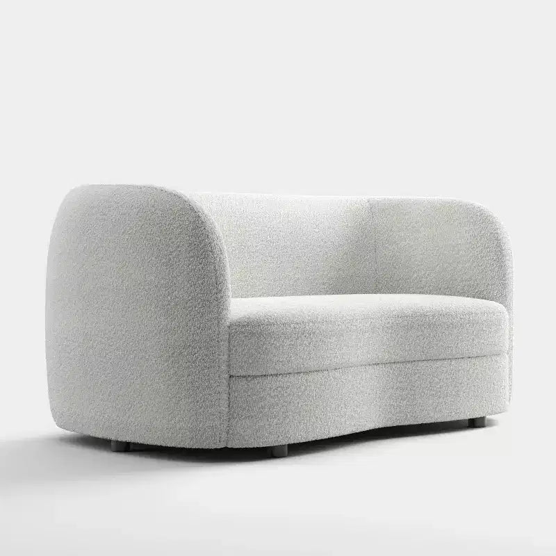 Divanetto curvo in tessuto bouclé Boho con cuscini a molle insacchettate